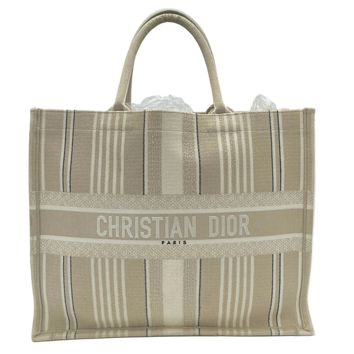 Christian Dior Book Tote Large Canvas Natural Cannage Raffia Creme
Stein Schwarz